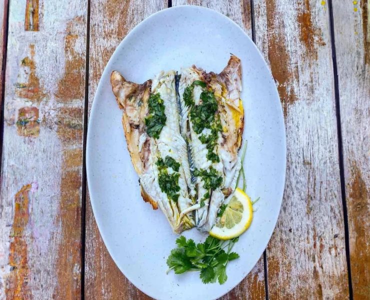 Whole branzino, stuffed with herbs and lemons, quickly touched by the flames of the grill, and served with lemon and herb infused olive oil. 